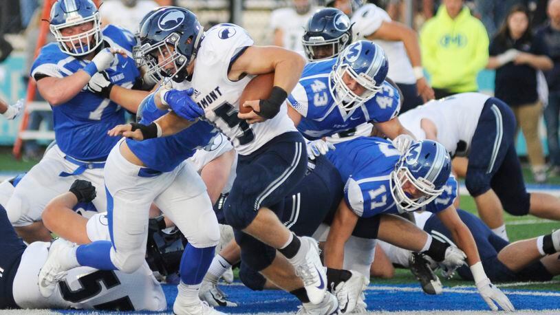 Fairmont’s Jesse Deglow is pursued by Miamisburg’s Cael Parkhurst (43), Dylan Wudke (17) and others. Fairmont defeated host Miamisburg 25-24 in a Week 6 game last season. Deglow is signing with Indiana Wesleyan, Parkhurst with Ashland and Wudke with Youngstown State. MARC PENDLETON / STAFF