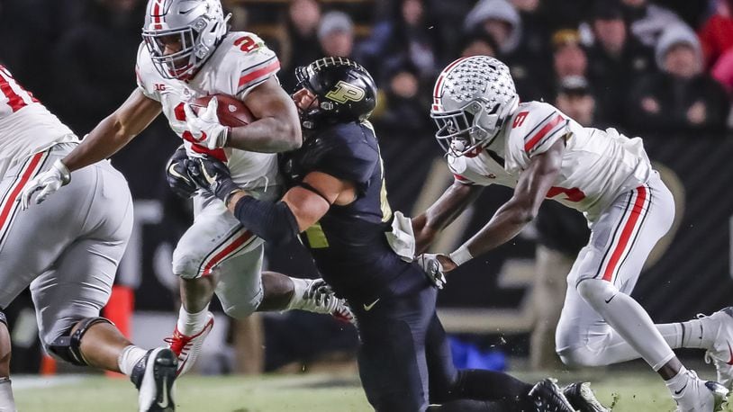 WEST LAFAYETTE, IN - OCTOBER 20: J.K. Dobbins #2 of the Ohio State Buckeyes runs the ball as Markus Bailey #21 of the Purdue Boilermakers hangs on for the stop at Ross-Ade Stadium on October 20, 2018 in West Lafayette, Indiana. (Photo by Michael Hickey/Getty Images)