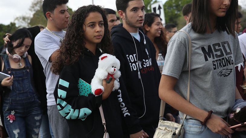 PARKLAND, FL - FEBRUARY 28: Students leave Marjory Stoneman Douglas High School after attending their classes for the first time since the shooting that killed 17 people on February 14 at the school on February 28, 2018 in Parkland, Florida. Police arrested 19-year-old former student Nikolas Cruz for the 17 murders. (Photo by Joe Raedle/Getty Images)