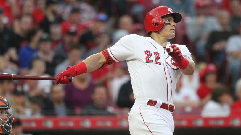 The Reds' Derek Dietrich hits a home run against the Giants on Friday, May 3, 2019, at Great American Ball Park in Cincinnati. David Jablonski/Staff