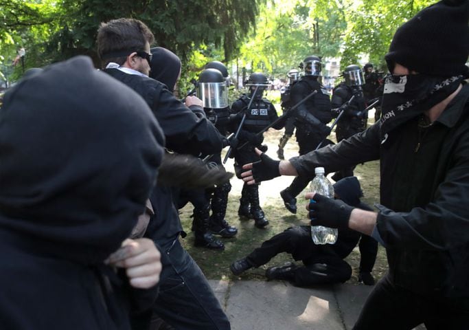 protesters clash at dueling rallies in portland