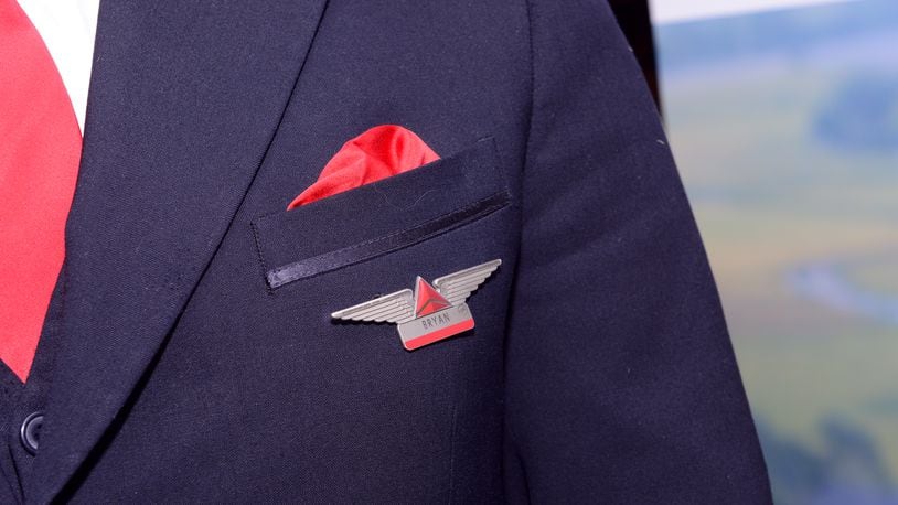 NEW YORK, NY - OCTOBER 17: A Delta employee displays a pin on his uniform. (Photo by Noam Galai/Getty Images for NYCWFF)