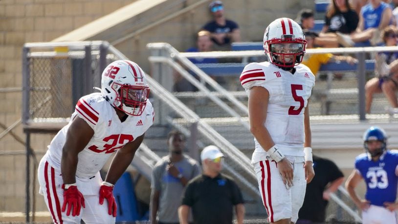 Wittenberg quarterback Max Milton, right, and running back Bryce Anderson line up for a play against Dubuque on Saturday, Sept. 2, 2023, in Iowa. Photo courtesy of Wittenberg University