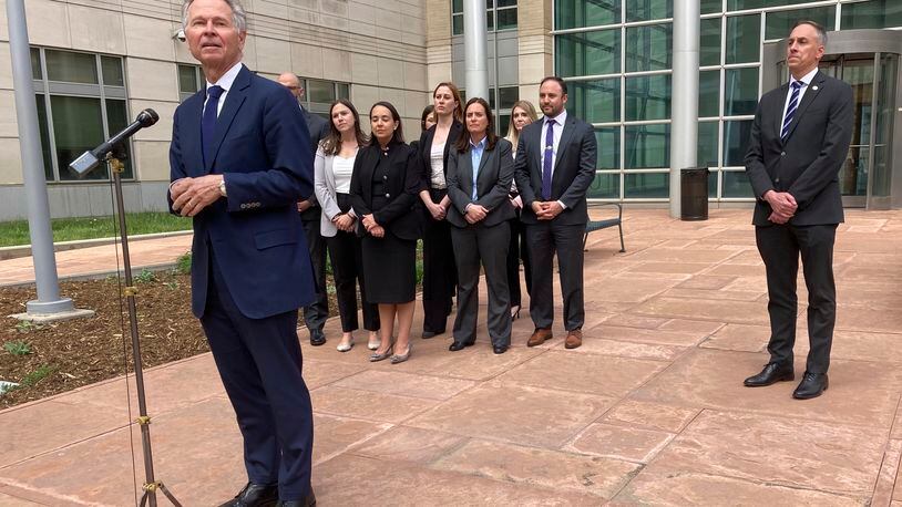U.S. Attorney for Colorado Cole Finegan, left, speaks outside Denver federal court after the sentencing of Jared Sebastian Dalke on Monday, April 29, 2024, in Denver. Behind him are federal prosecutors and FBI Special Agent in Charge Mark Michalek. Former National Security Agency employee Dalke, who sold classified information to an undercover FBI agent he believed to be a Russian official, was sentenced Monday to nearly 22 years in prison, the penalty requested by government prosecutors. (AP Photo/Colleen Slevin)