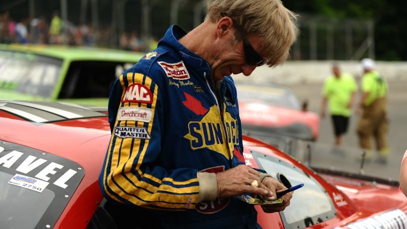 Two-time Daytona 500 champion Sterling Marlin signs autographs for fans during a pre-race meet and greet at Shady Bowl Speedway on Saturday. Marlin, from Columbia, Tenn., was involved in a three-car accident early in the feature and finished 19th. Contributed / Greg Billing