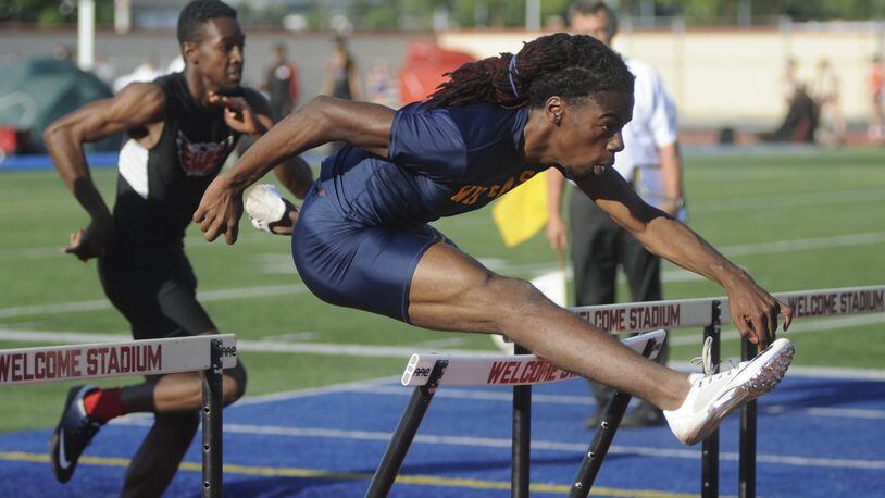 Springfield junior Dyier Smith won the 110-meter high hurdles during the D-I regional track and field meet at Dayton’s Welcome Stadium on Friday, May 26, 2017. MARC PENDLETON / STAFF