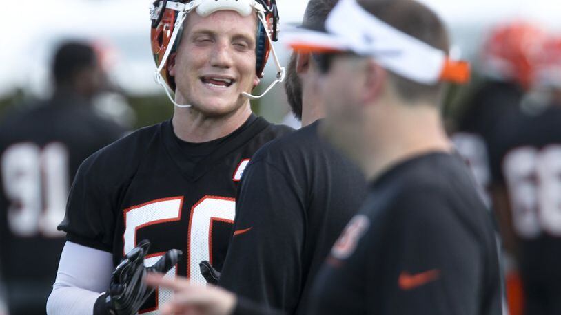 Bengals linebacker A.J. Hawk (50) takes a break from drills during the opening day of Bengals training camp, Friday, July 31, 2015. GREG LYNCH / STAFF FILE PHOTO