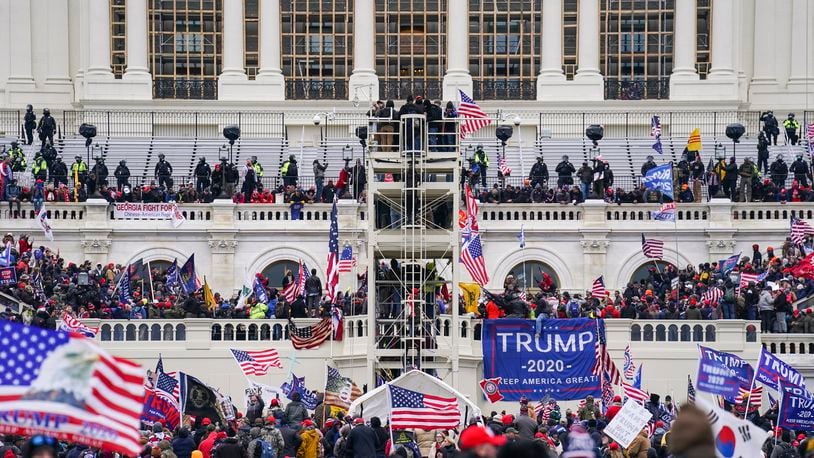 FILE - Insurrectionists loyal to President Donald Trump breach the Capitol in Washington, Jan. 6, 2021. (AP Photo/John Minchillo, File)
