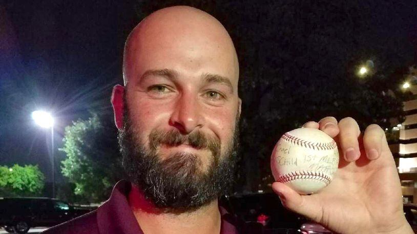 Mike Hauschild shows off a ball from his big-league debut with the Texas Rangers on Saturday, April 8, 2017, in Arlington, Texas. Photo by Kim Hauschild