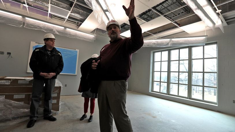Urbana Schools superintendent Charles Thiel lead a tour of the new Urbana High School which is scheduled to open after spring break. Bill Lackey/Staff