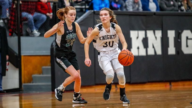 Greenon High School senior Reagan Ware is guarded by Catholic Central’s Lizzie Bruce during their game on Tuesday, Jan. 22. The Knights won 51-46. CONTRIBUTED PHOTO BY MICHAEL COOPER