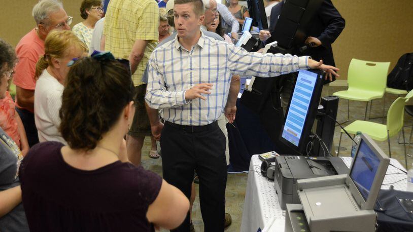 Most counties in Ohio, including Butler County, are in need of new voting machines. There is a state bill in the Ohio legislature that would pay for the lowest cost model for every county in Ohio. Pictured are Butler County residents on Wednesday, July 26, 2017, learning about one of the six voting machines vendors were displaying at the Butler County Board of Elections. vendors. The election officials said it could take between $3 million and $6 million to replace its aging equipment. MICHAEL D. PITMAN/STAFF