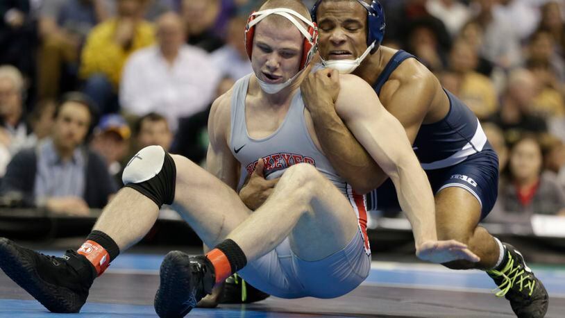Penn State’s Mark Hall wrestles Ohio State’s Bo Jordan in the 174-pound match in the championship round of the NCAA Division I wresting championships, Saturday, March 18, 2017, in St. Louis. (AP Photo/Tom Gannam)