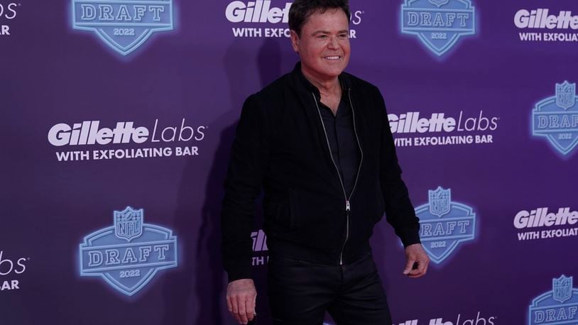 Singer Donny Osmond poses on the red carpet before the first round of the NFL football draft Thursday, April 28, 2022, in Las Vegas. He will perform July 26 at Kettering's Fraze Pavilion. (AP Photo/Jae C. Hong )