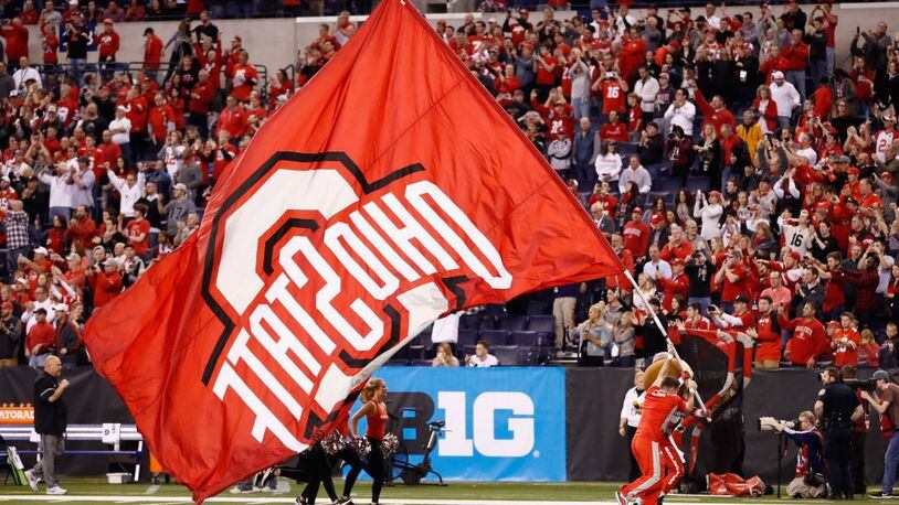 INDIANAPOLIS, IN - DECEMBER 02:  The Ohio State Buckeyes cheerleaders perform holding a flag while playing against the Wisconsin Badgers during the Big Ten Championship game at Lucas Oil Stadium on December 2, 2017 in Indianapolis, Indiana.  (Photo by Andy Lyons/Getty Images)