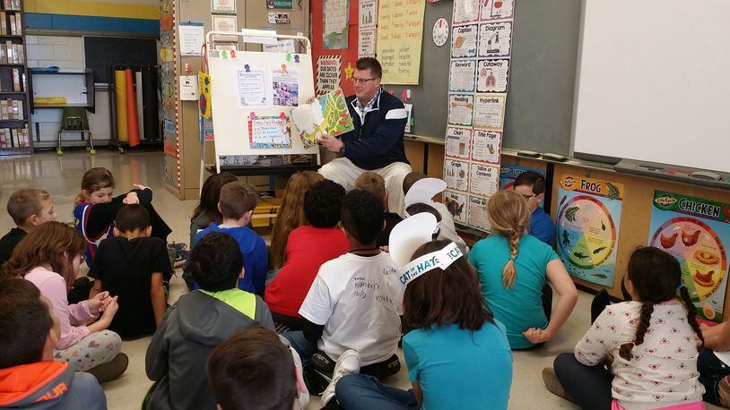 Northeastern Superintendent John Kronour reads to students. Contributed photo