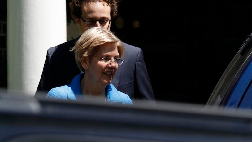 Sen. Elizabeth Warren, D-Mass. leaves the Washington home of Democratic presidential candidate Hillary Clinton. With the primary over and Vermont Sen. Bernie Sanders fading from the spotlight, Warren is stepping up to reclaim her role as leader of the party’s progressives. She’s mobilizing behind Clinton, lending her presidential bid a powerful boost of liberal credibility.  (AP Photo/Paul Holston, File)