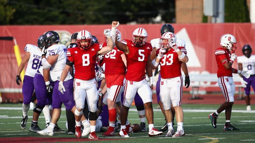 Wittenberg defenders, including Dane Flatter (8), Mario Getaw (5) and Cameron Snurr (33) prepare for a play against Kenyon on Saturday, Sept. 16, 2023, at Edwards-Maurer Field in Springfield. David Jablonski/Staff