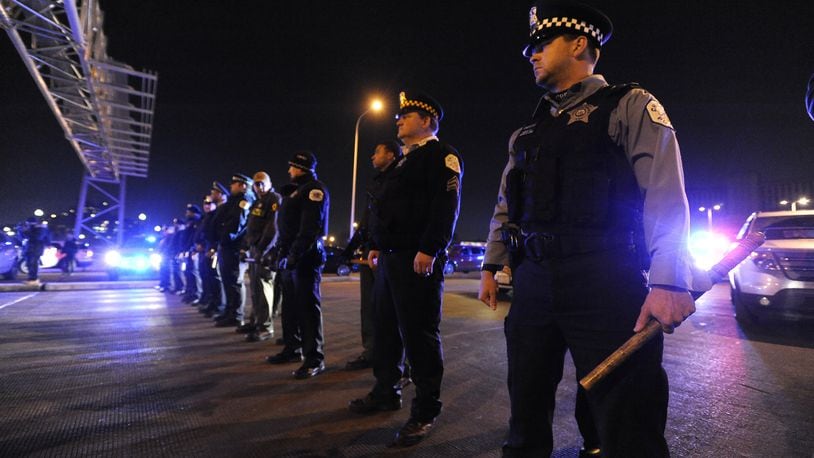 Chicago police form a line to prevent protestors from entering an expressway on Nov. 24, 2015, in Chicago.