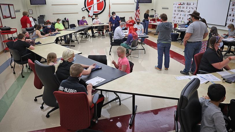 Clark County health district officials say vaccines within the minority community are down, but clinics going well, such as the one held at Tecumseh High School. BILL LACKEY/STAFF