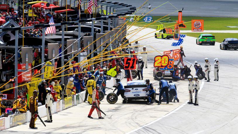 Drivers pit during Sunday’s Quaker State 400 race at Kentucky Speedway Sunday, June 30, 2013. NICK DAGGY / STAFF