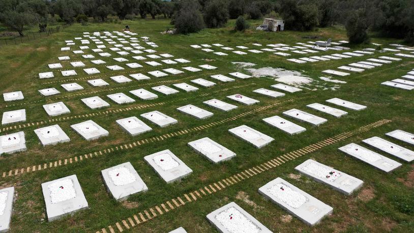 A cemetery is seen from above at Kato Tritos village on the northeastern Aegean Sea island of Lesbos, Greece, on Wednesday, April 17, 2024. After years of neglect, a primitive burial ground for refugees who died trying to reach Greece's island of Lesbos has been cleaned up and redesigned to provide a dignified resting place for the dead. (AP Photo/Panagiotis Balaskas)