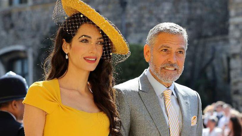 Amal Clooney and George Clooney arrive for the wedding ceremony of Prince Harry and Meghan Markle at St. George's Chapel in Windsor Castle in Windsor, near London, England, Saturday, May 19, 2018. (Gareth Fuller/pool photo via AP)