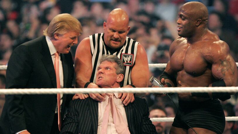 DETROIT - APRIL 1: WWE chairman Vince McMahon (C) has his head shaved by Donald Trump (L) and Bobby Lashley (R) while being held down by ''Stone Cold'' Steve Austin after losing a bet in the Battle of the Billionaires at the 2007 World Wrestling Entertainment's Wrestlemania at Ford Field on April 1, 2007 in Detroit, Michigan. Umaga was representing McMahon in the match when he lost to Bobby Lashley who was representing Trump. (Photo by Bill Pugliano/Getty Images)