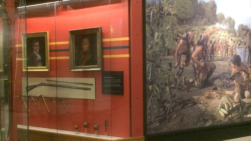 At the Heritage Center, there are two portraits of Clark and a mural by John Buxton depicting the battle, along with 13-year-old future Shawnee chief, Tecumseh. Nearby are remnants from the battle including cannonballs, tomahawks, a rifle, and a rare walking bow, all recovered from the field almost 240 years ago. Photo courtesy of the Clark County Historical Society.