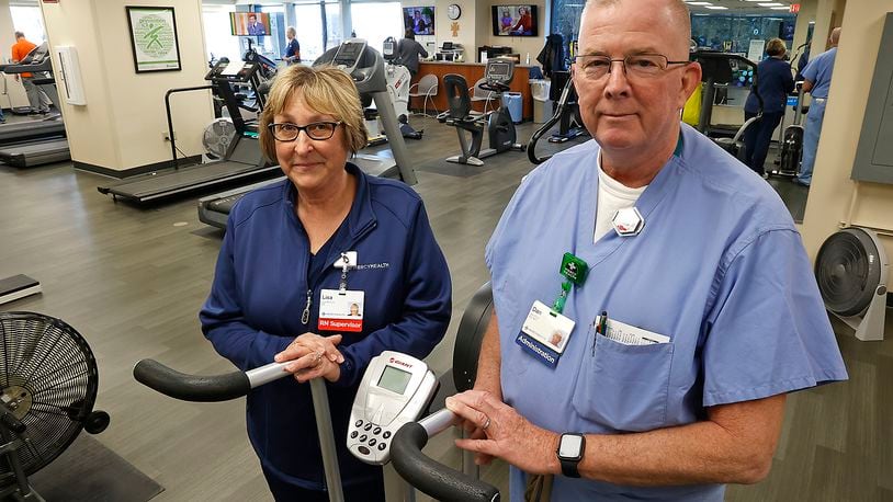 Mercy Health – Springfield/Urbana will host a Heart and Vascular Dinner and United Seniors Services will host a Heart Strong event for American Heart Month. In this file photo, Lisa McClure, supervisor of the Mercy Health Cardiac Rehab unit, and Dan Price, manager of the Mercy Health Cardiac Services, in the Cardiac Rehab unit at Springfield Regional Medical Center last year. BILL LACKEY/STAFF
