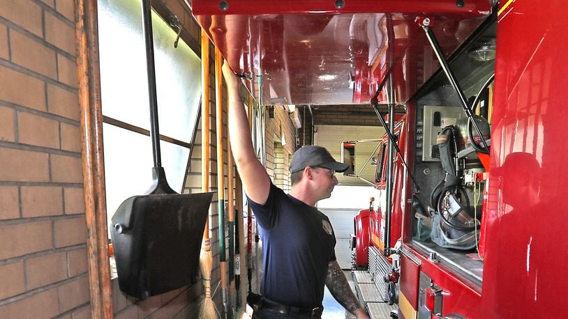 Springfield firefighters have to be careful when opening the doors on the fire engine because the garage bay is so small at Fire Station 3 on Selma. That station is looking to be replaced as the City of Springfield plans to build three new stations. BILL LACKEY/STAFF