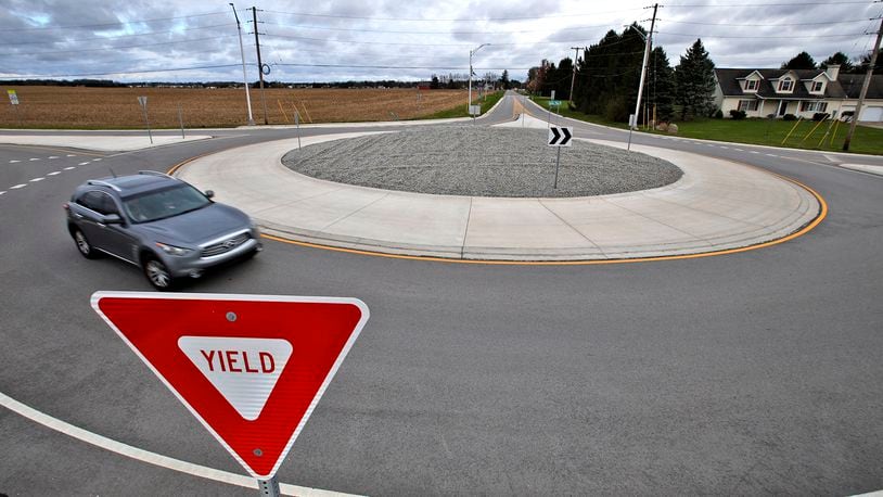 A car travels around the roundabout at the intersection of Selma Road and Possum Road Friday, April 5, 2024. Clark County is researching if more roundabouts are needed in the county and where. BILL LACKEY/STAFF