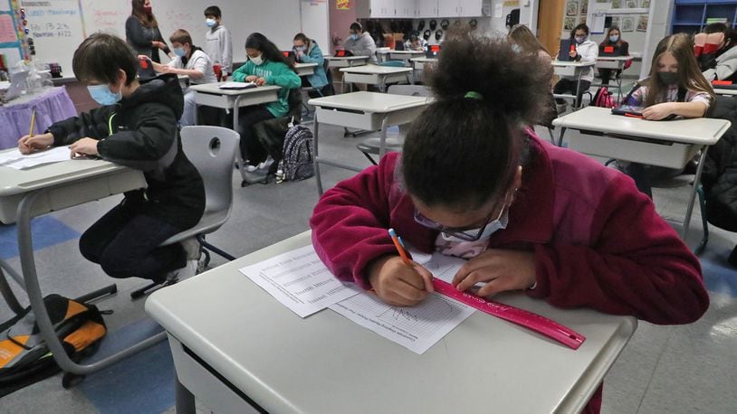 K-12 state tests for Clark, Champaign schools ongoing through COVID pandemic. Here, students at Simon Kenton Elementary work on classwork. BILL LACKEY/STAFF