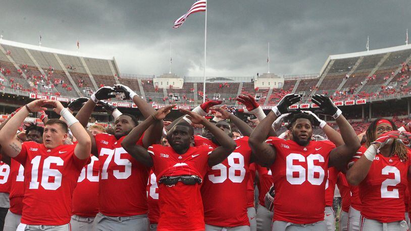 Ohio State players sing “Carmen Ohio” after a victory over Oregon State on Saturday, Sept. 1, 2018, at Ohio Stadium in Columbus. David Jablonski/Staff