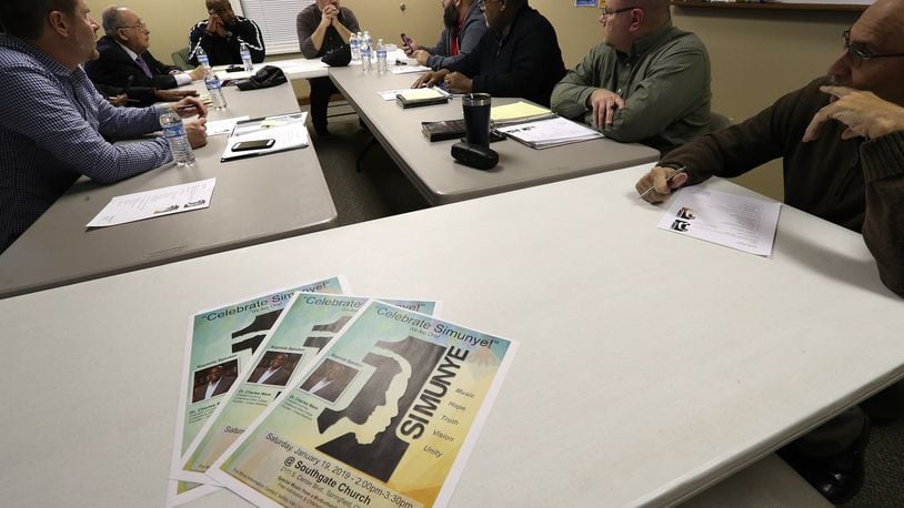 A diverse group of area pastors and other influential Christian leaders meet to discuss the upcoming “Simunye”, a racial reconciliation event at Southgate Baptist Church Wednesday. BILL LACKEY/STAFF