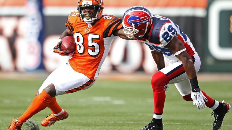 CINCINNATI - NOVEMBER 21: Chad Ochocinco #85 of the Cincinnati Bengals runs with the ball while defended by Drayton Florence #29 of the Buffalo Bills during the NFL game at Paul Brown Stadium on November 21, 2010 in Cincinnati, Ohio. The Bills won 49-31. (Photo by Andy Lyons/Getty Images)