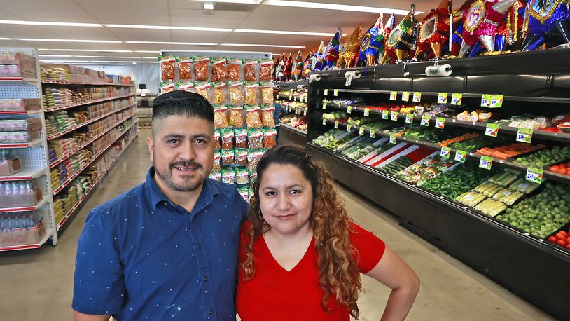 Alicia Marcado and her husband, Saul, in their new store, Adasa Latin Market, at 1883 South Limestone Street Friday, July 14, 2023. BILL LACKEY/STAFF