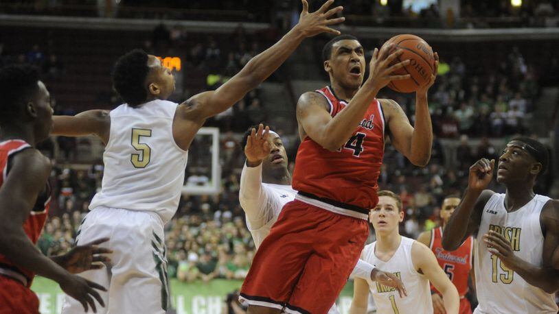 Trotwood-Madison senior Torrey Patton (with ball) set a D-II state semifinal record by scoring 34 points in a 62-60 loss to Akron St. Vincent-St. Mary in a boys high school basketball Division II state semifinal game at OSU’s Schottenstein Center in Columbus on Thursday, March 23, 2017. MARC PENDLETON / STAFF