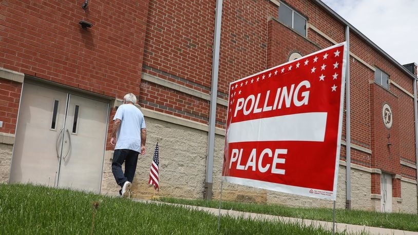 A voter walks into the New Carlisle polling place at Tecumseh High School Tuesday. BILL LACKEY/STAFF