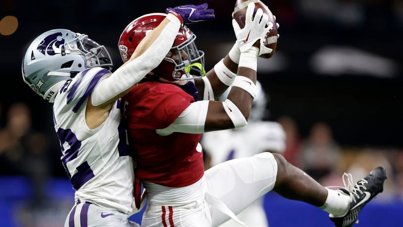Alabama defensive back Jordan Battle (9) intercepts a pass intended for Kansas State running back Deuce Vaughn (22) during the first half of the Sugar Bowl NCAA college football game Saturday, Dec. 31, 2022, in New Orleans. (AP Photo/Butch Dill)