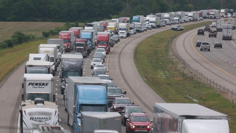 Traffic was backed up for miles on eastbound I-70 after a crash between a tractor-trailer rig and several cars east of Ohio Route 54 in Clark County on Monday, June 12, 2023. BILL LACKEY/STAFF