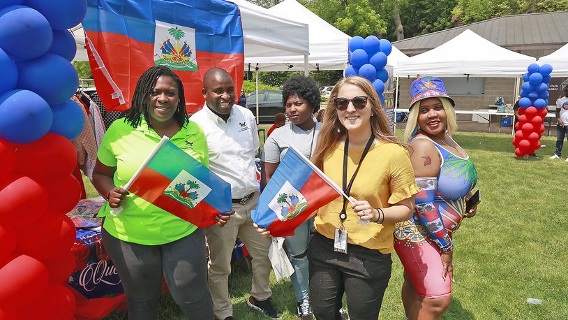 A group from the Rocking Horse Center with Guerline Etienne, right, at the Haitian Flag Day Festival Thursday, May 18, 2023. BILL LACKEY/STAFF