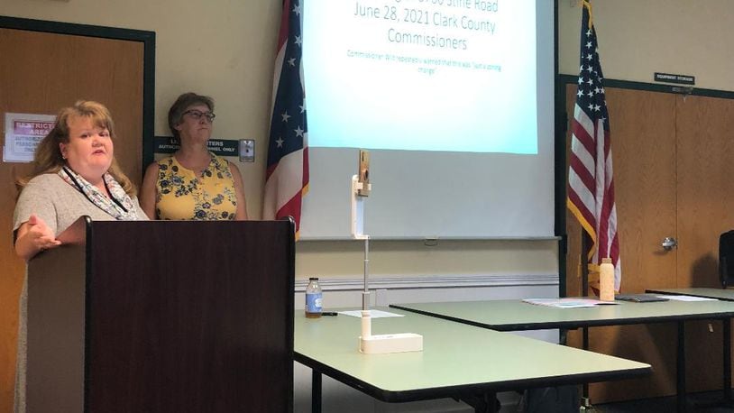 Kathleen Baber, left, and Kathy Voytko led a meeting of more than 60 Mad River Township residents in Enon Wednesday to discuss concerns for a recently approved rezoning for a proposed subdivision. Photo by Brett Turner
