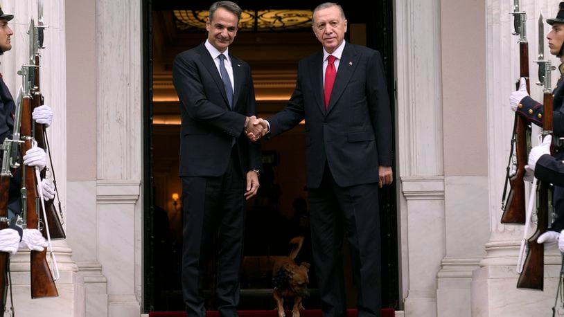 FILE - Greece's Prime Minister Kyriakos Mitsotakis, left, welcomes the Turkey's President Recep Tayyip Erdogan before their meeting at Maximos Mansion in Athens, Greece, Thursday, Dec. 7, 2023. Old foes Turkey and Greece will test a five-month-old friendship initiative on Monday, May 13, 2024 when Greek Prime Minister Kyriakos Mitsotakis visits Ankara. (AP Photo/Thanassis Stavrakis, File)