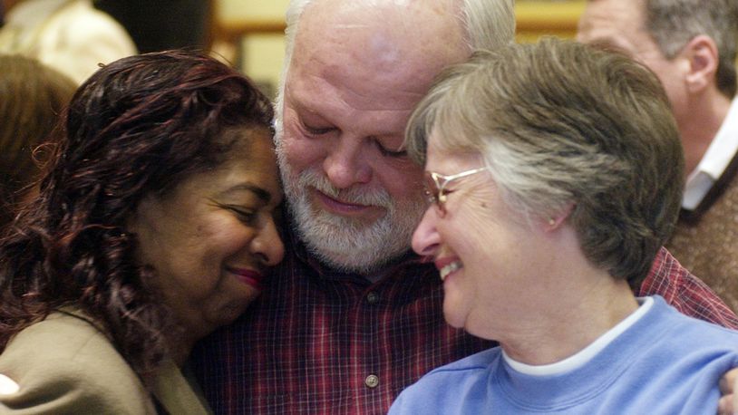 Former Springfield school superintendent Jean Harper, former Mayor Warren Copeland and his wife Clara Copeland embrace after finding out Springfield City School district passed a levy in this 2006 photo.
News-Sun Photo by Teesha McClam