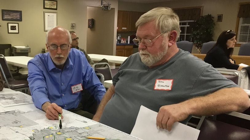 Clark County residents Andy Elder and John Blanton discuss areas they believe could be preserved or developed at Tuesday s Clark County Connect meeting at the South Vienna Government Center on Thursday as part of efforts to update the county s land use plan. MICHAEL COOPER/STAFF