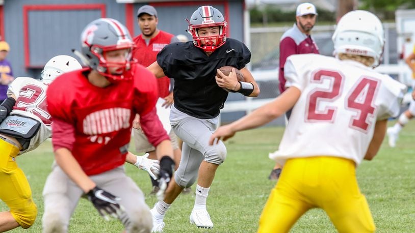 Southeastern High School sophomore quarterback Wade Eriksen runs the ball against Northeastern during a five-team scrimmage on Saturday morning in South Charleston. CONTRIBUTED PHOTO BY MICHAEL COOPER