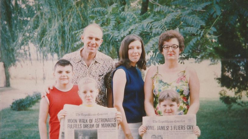 Pam Cottrel, at age 19, and her family pose with newspapers documenting U.S. astronauts landing on the moon. CONTRIBUTED