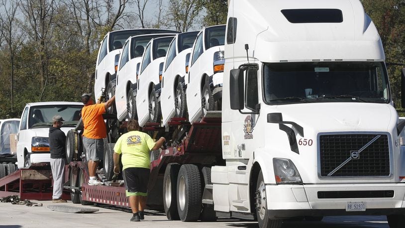 This file photo shows the loading of GM vehicles built at Navistar’s Springfield plant in 2017.  Navistar reported a net loss of $347 million during its 2020 fiscal year. Bill Lackey/Staff