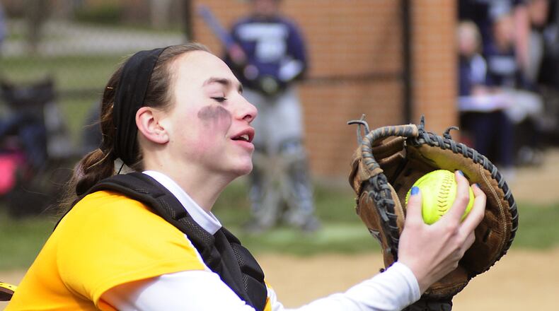 Kenton Ridge's catcher Kenzie Tyson (1) make the out on an infield popup fly ball during girls softball between the Fairmont Firebirds and Kenton Ridge Cougars held Saturday, April 6, 2013 at Kettering Fairmont High School Photo by Charles Caperton